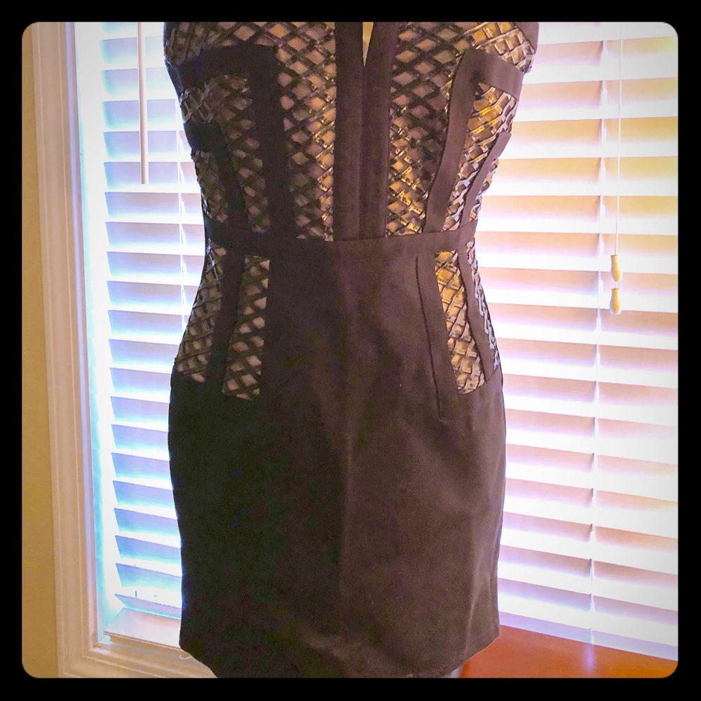 A mini black and nude color mini dress.